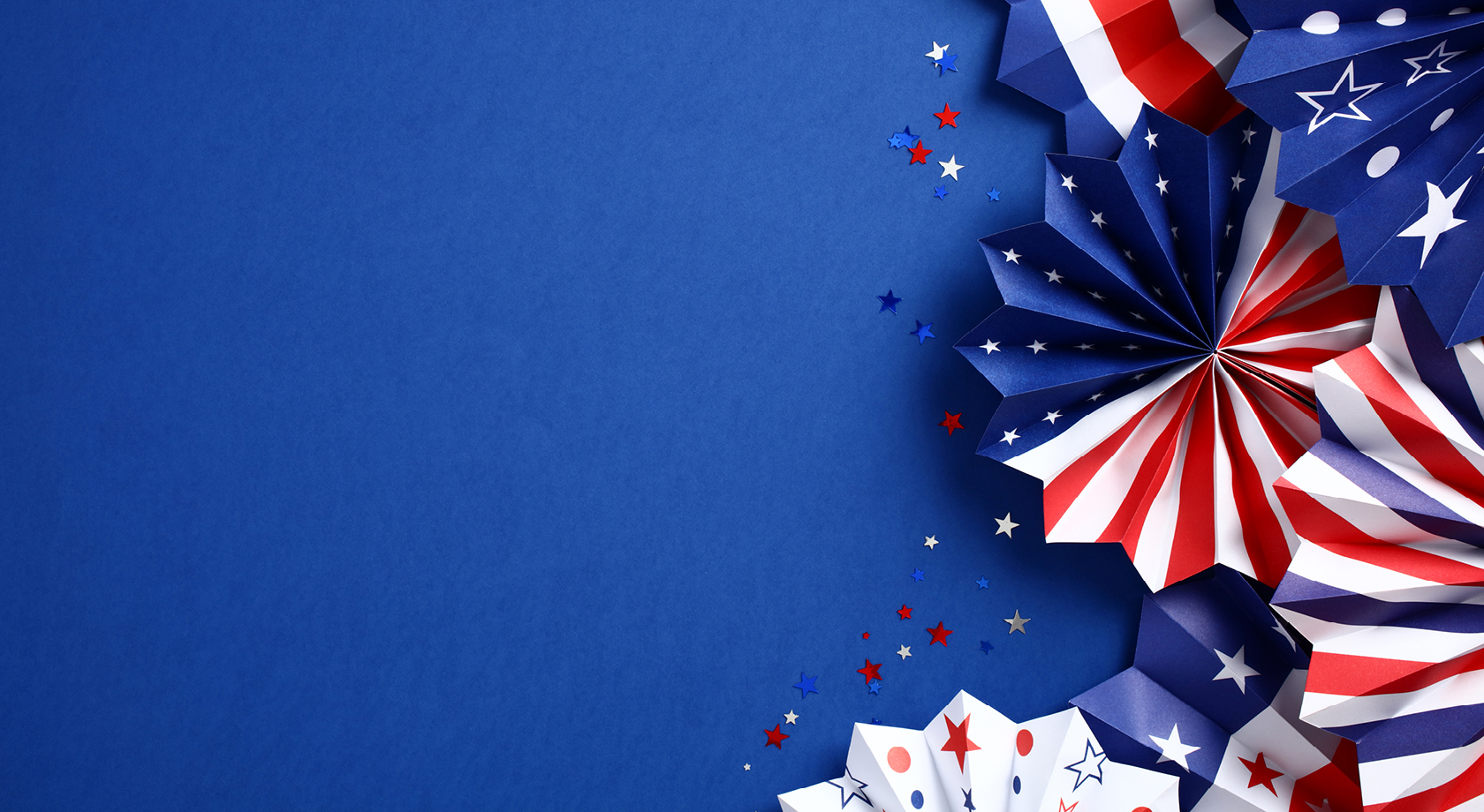 Blue Background with big red, white, and blue ribbons 
